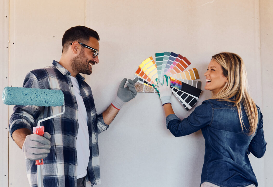 Young couple with paint swatches
